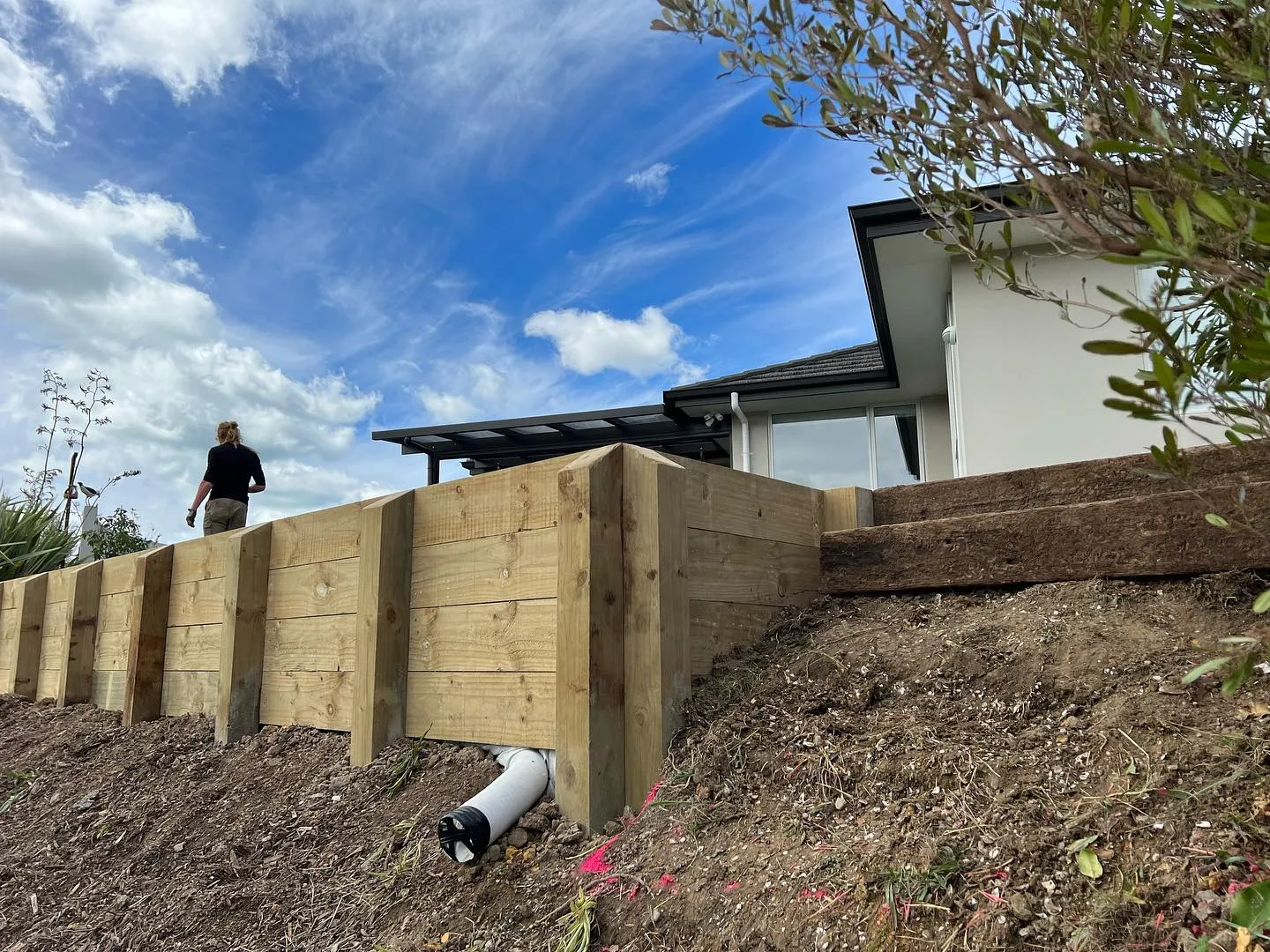 Timber retaining wall build in progress